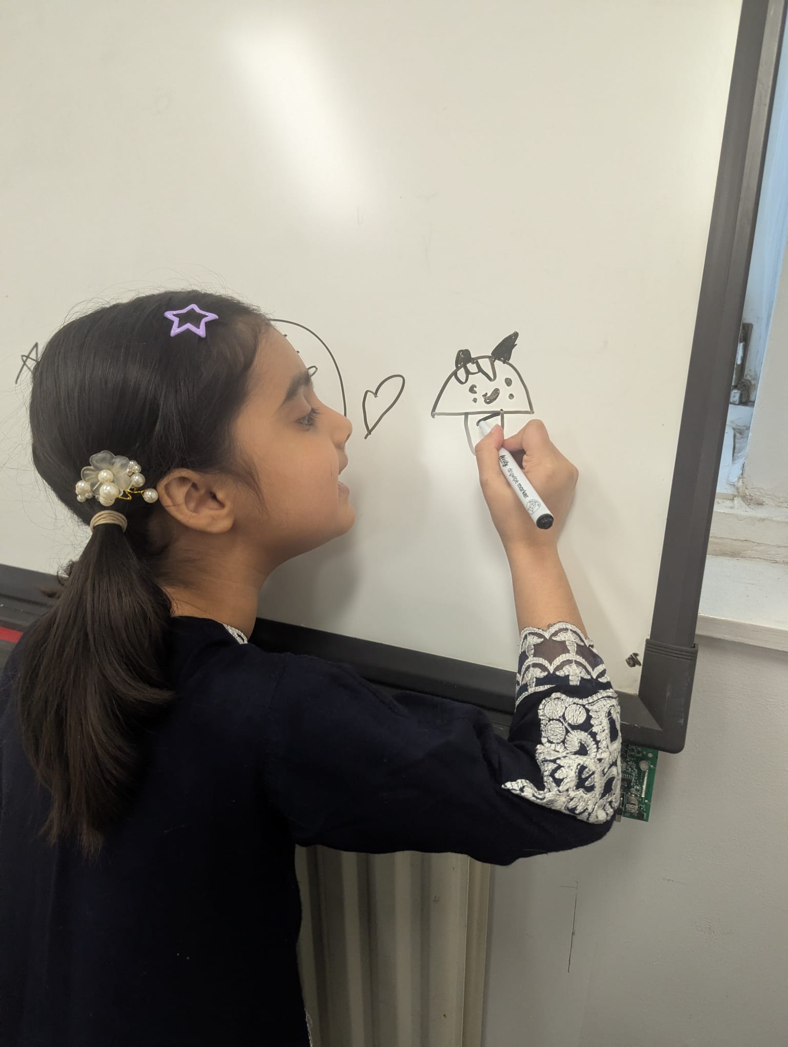A young visitor taking part in a learning activity at our centre